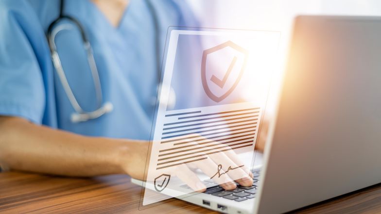 doctor viewing laptop with virtual security visualization