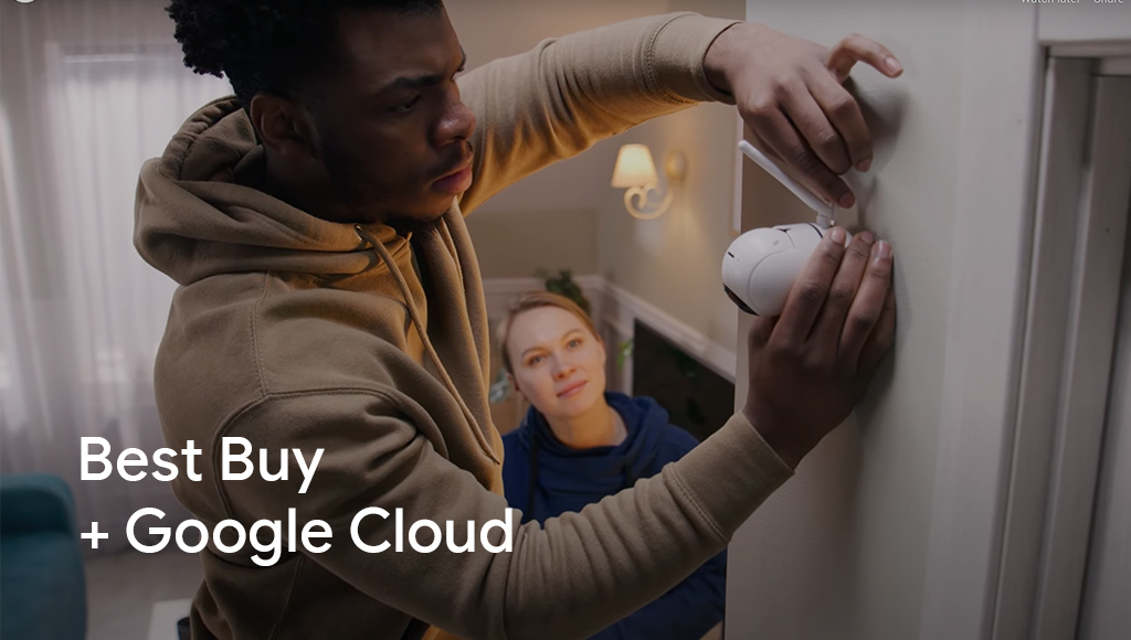 Man putting up camera 