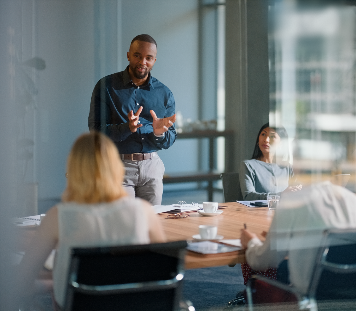 Man discussing with the team in conference room